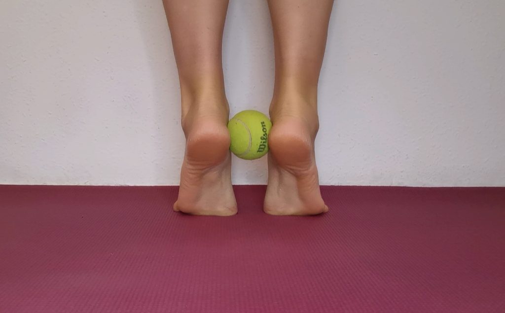 barefoot exercise with tennis ball